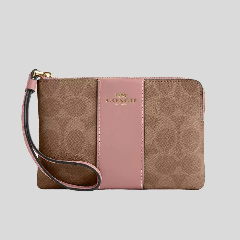 Coach crossbody bags in a vibrant, eye - catching color for a bold statementCOACH Corner Zip Wristlet In Signature Canvas With Stripe Tan/Pink Petal CW854