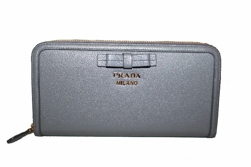 Prada Cahier bags featuring the signature triangular logo plaqueAuthentic Prada Grey Women's Bow Detail Continental Leather Wallet