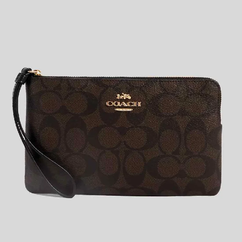 Coach Rogue bags featuring the signature C - hardware for a branded lookCOACH Large Corner Zip Wristlet In Signature Canvas Brown/Black CS438