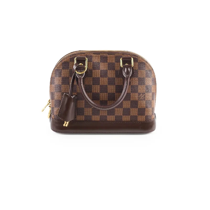 Louis Vuitton crossbody bags in a bold red color for a statementLouis Vuitton Alma BB Damier Ebene