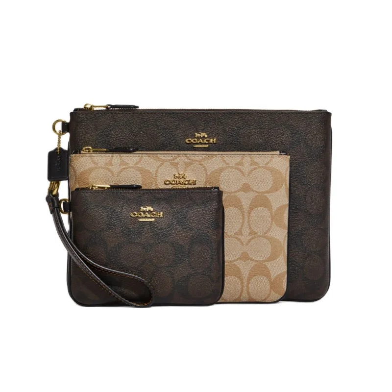 Coach Rogue bags with a monogram - embossed leather surfaceCoach CC864 Pouch Trio In Blocked Signature Canvas