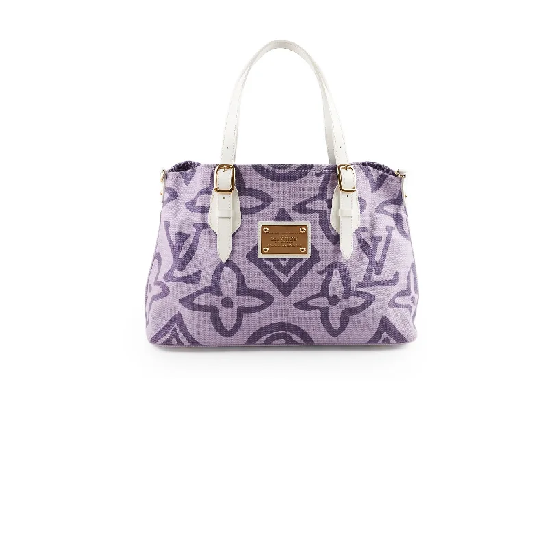 Ladies Louis Vuitton Petite Malle bags in a pastel color for a soft lookLouis Vuitton Tahitienne Cabas Purple Monogram Tote