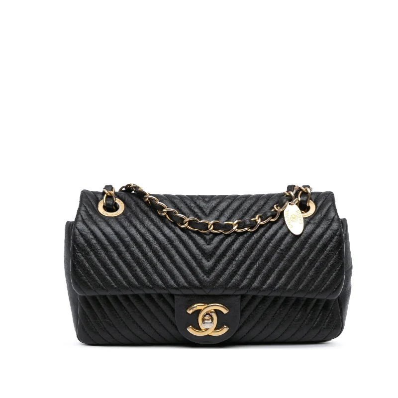 Chanel bags with exclusive seasonal designs and materialsBlack Chanel Small Chevron Wrinkled Lambskin Medallion Charm Surpique Flap Shoulder Bag