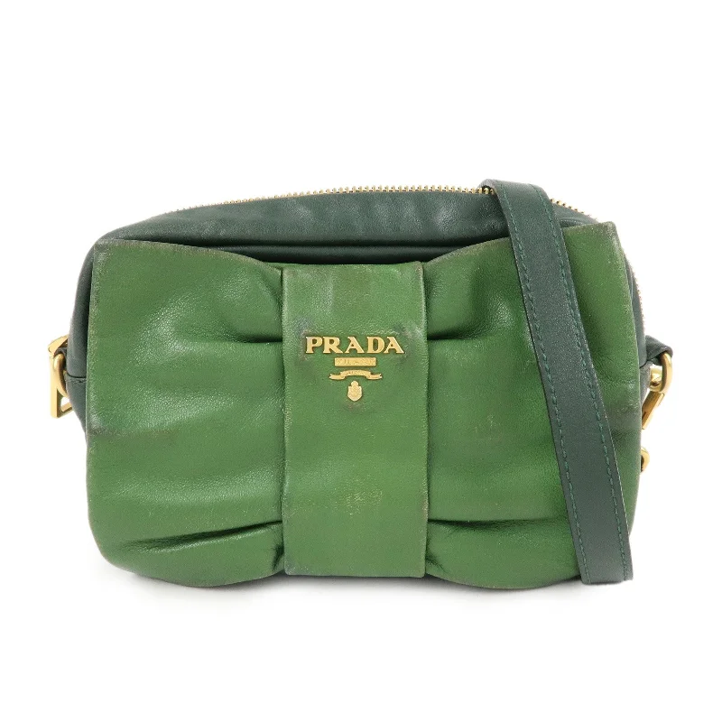 Prada Cahier bags with a monogram - embossed leather surfacePRADA Logo Leather Ribbon Shoulder Bag Green BP0166