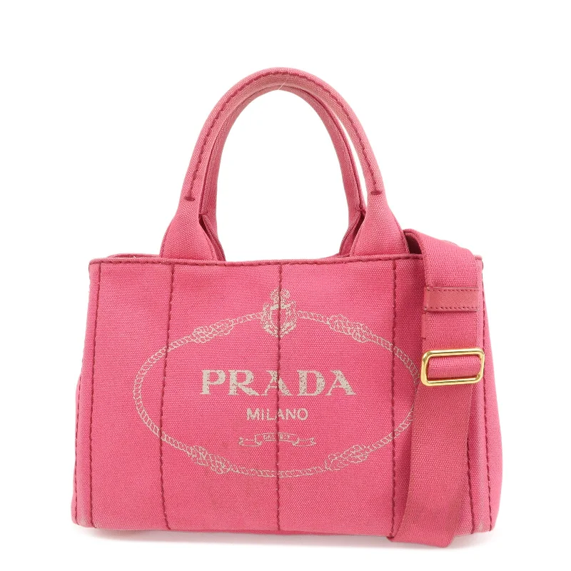 Ladies Prada Re - Edizione 2005 bags with a star - shaped charm for a playful touchPRADA Logo Canapa Mini Canvas 2Way Bag Pink 1BG439