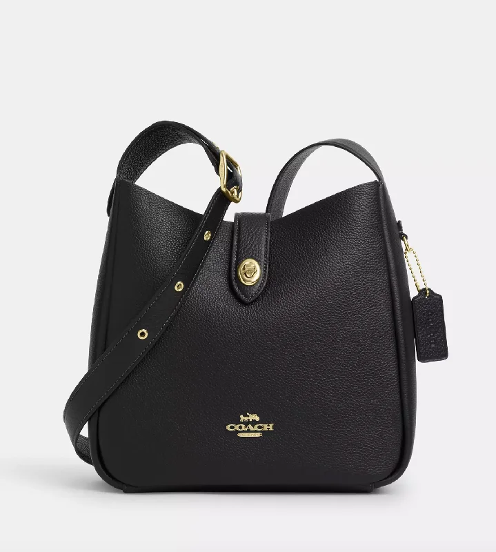 Coach Rogue bags with a monogram - embossed leather surfaceCoach Hadley Convertible Crossbody Bag In Gold Black