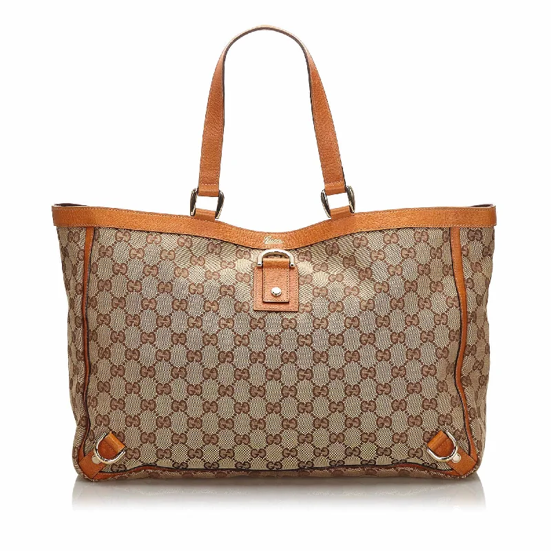 Women Gucci backpacks with a luxurious leather finishGucci Brown Beige Canvas Fabric GG Abbey D Ring Tote Bag Italy