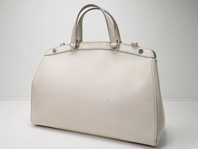 Louis Vuitton Twist bags with a crystal - embellished LV - turnlockAuthentic Pre-owned Louis Vuitton Epi Ivoire Ivory Brea Mm Hand Tote Bag M40330 180757