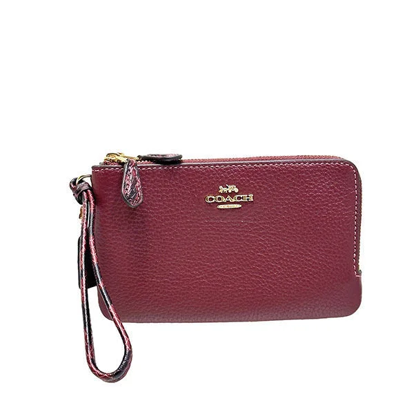 Coach tote bags with a snap - button closure and a decorative charm for styleCoach Double Zip Small Wristlet