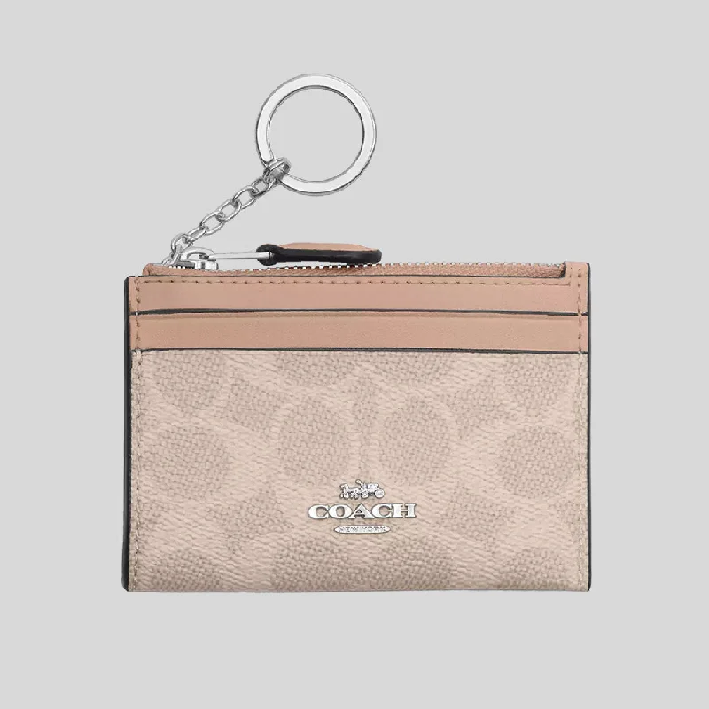 Coach tote bags with a snap - button closure and a decorative charm for styleCOACH Mini Skinny ID Case In Signature Canvas Sand/Taupe CW870