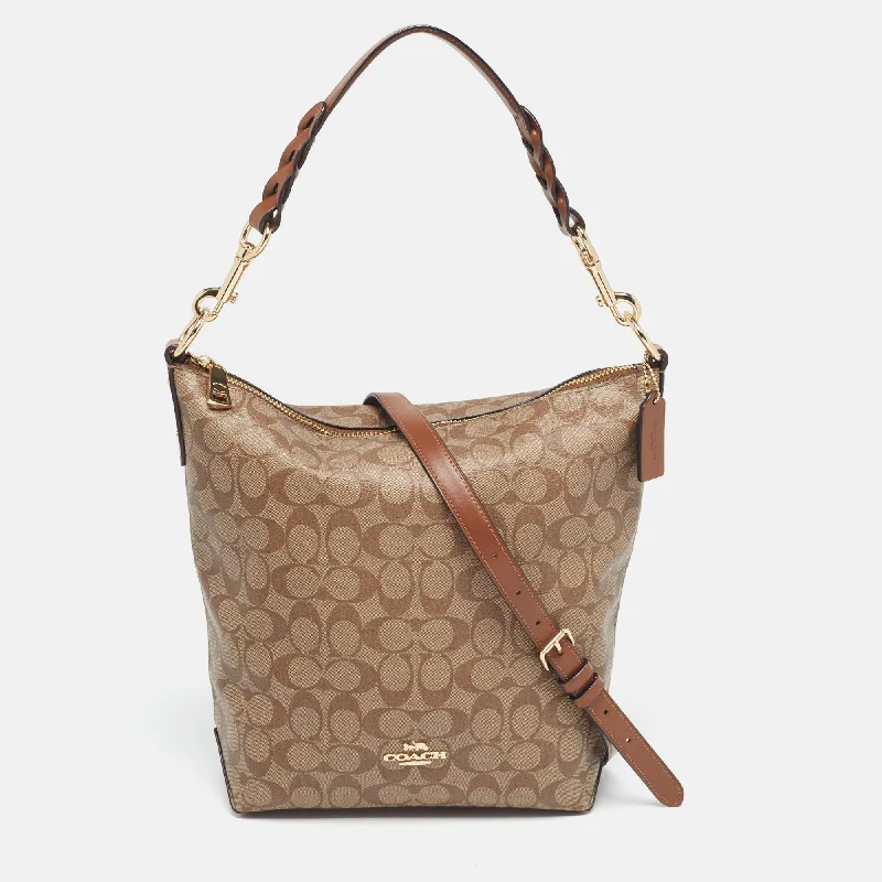 Coach Borough bags with a contrast - stitched handle for a unique lookBrown/Beige Signature Coated Canvas Abby Duffle Shoulder Bag