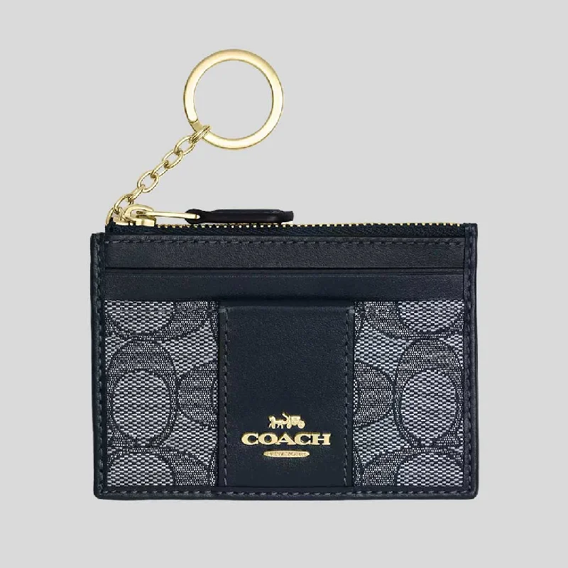 Coach handbags with a beaded trim for a glamorous and elegant lookCOACH Mini Id Skinny In Signature Jacquard Midnight Navy Multi CU988