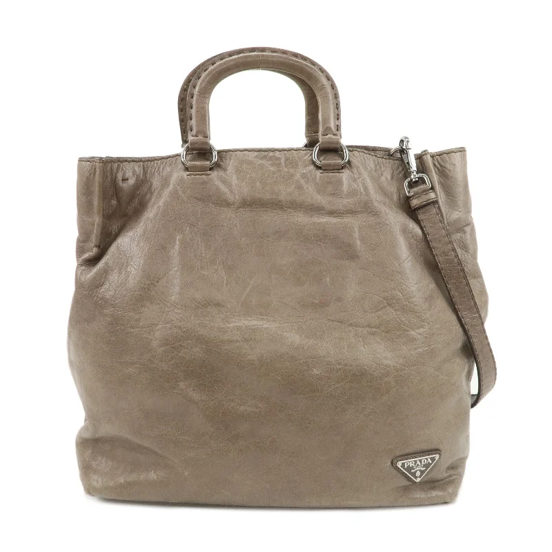 Prada bags with a snap - button closure and a decorative charm for a fashionable lookPRADA Logo Leather 2Way Bag Tote Bag Shoulder Bag Beige BR4617