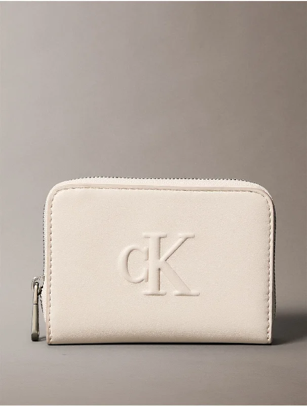 Calvin Klein bags with metallic and matte texturesWomen's Sculpted Impression Wallet - Pink