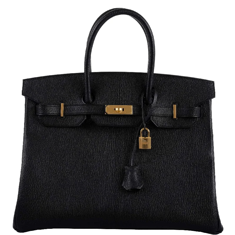 Hermès Kelly Bags in a vibrant electric blue for a pop of colorHermes Birkin Bags with a Detachable Mirror Pocket InsideHermès Birkin 35 Black Chevre De Coromandel with Gold Hardware - 2019, D