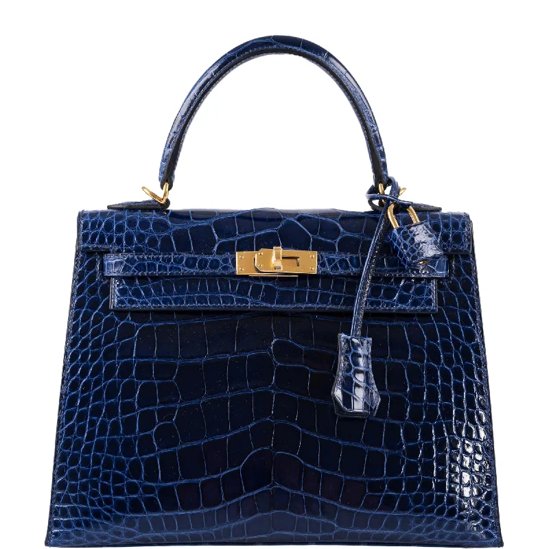 Hermès Kelly Bags in a deep emerald green for a regal lookHermès Kelly 25 Sellier Blue Sapphire Alligator Gold Hardware