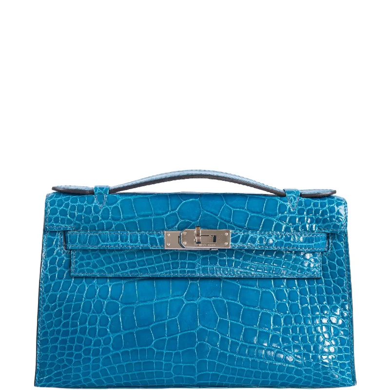 Hermès Kelly Bags made of exotic alligator leather for ultimate luxuryHermès Kelly Pochette Blue Izmir Shiny Alligator Palladium Hardware