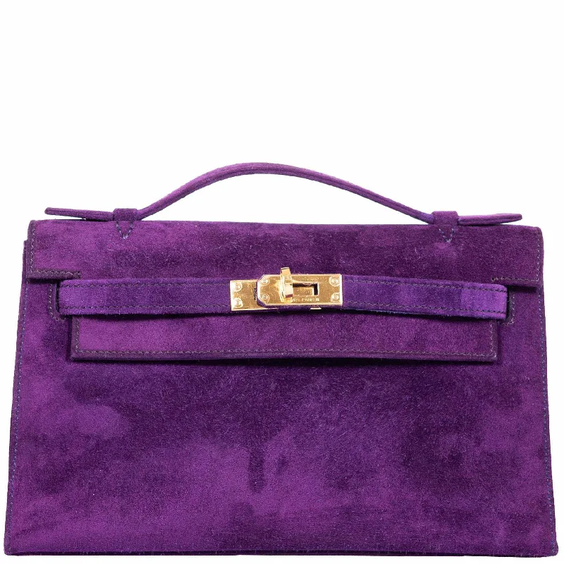 Hermès Kelly Bags with a decorative tassel charmHermès Kelly Pochette Violet Veau Doblis Suede Gold Hardware