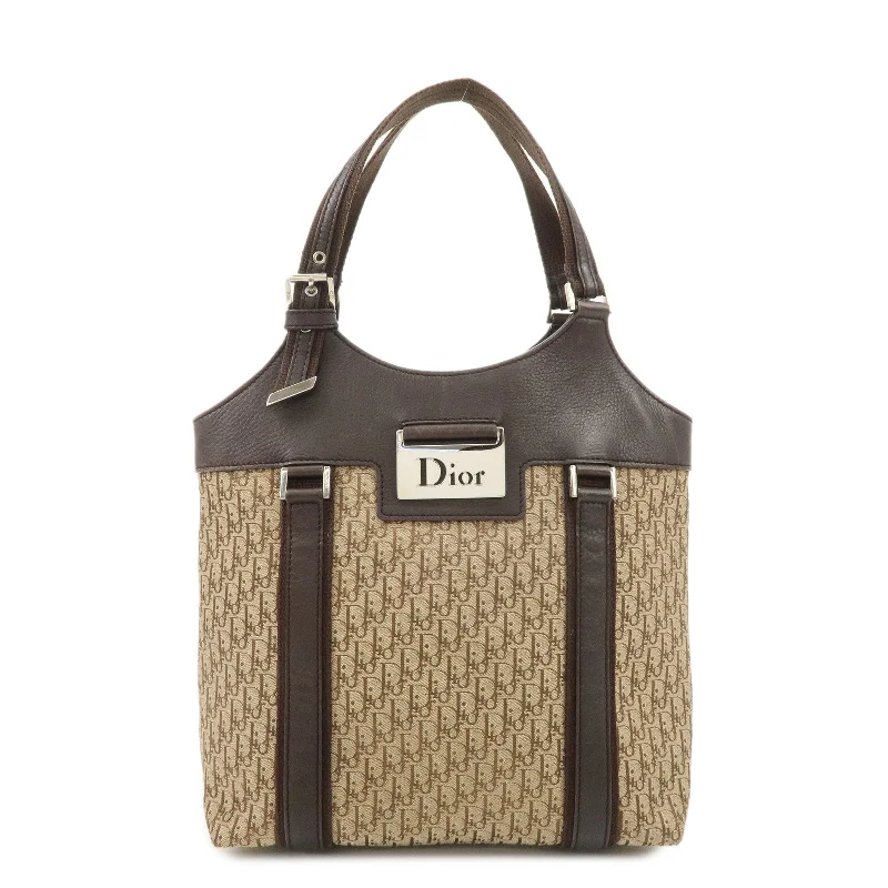 Christian Dior handbags with a snap - button closure and a decorative buckleChristian Dior Trotter Canvas Leather Tote Bag Beige Brown