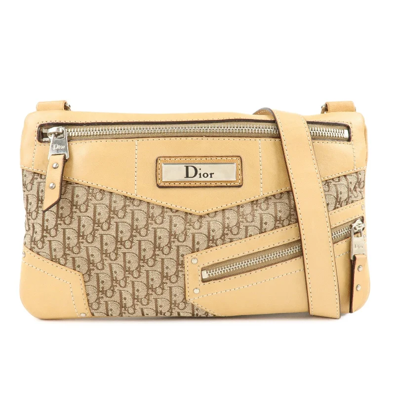 Contemporary Christian Dior handbags with a unique shapeChristian Dior Street Chic Trotter Canvas Leather Shoulder Bag